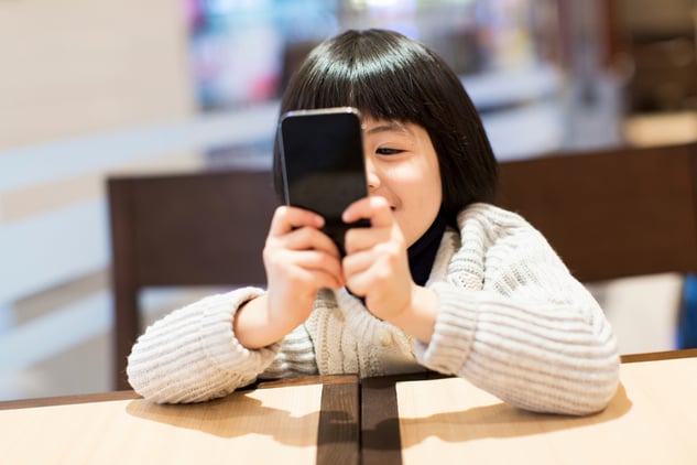 girl with smartphone. Digital Detox: Is your child turning into a digital addict?